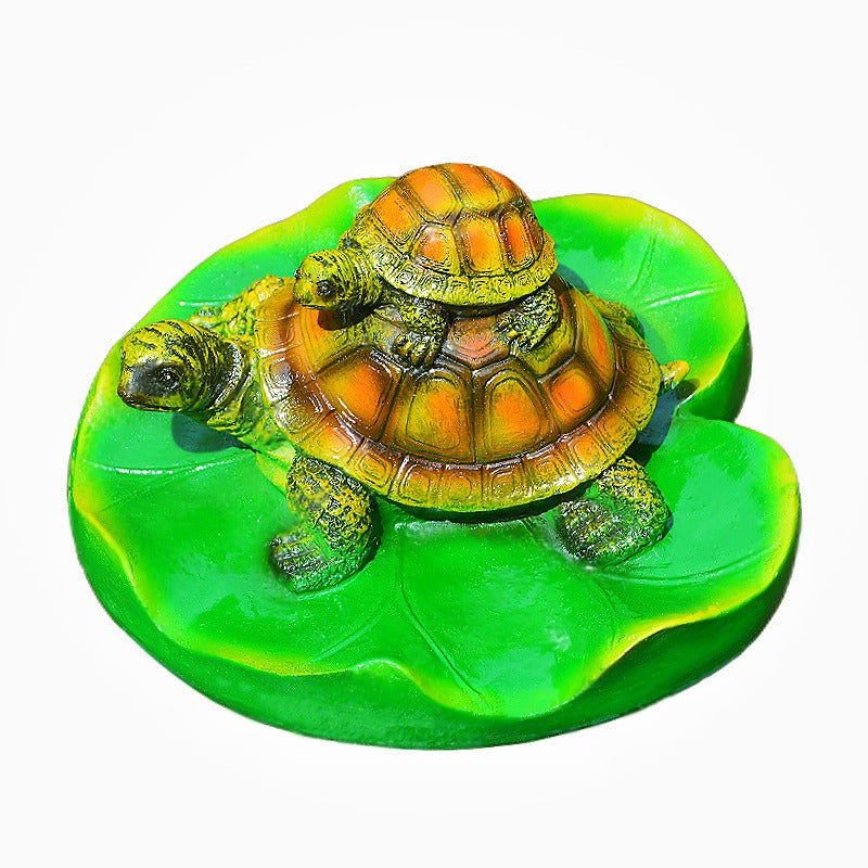Turtle resin ornaments floating on the water surface