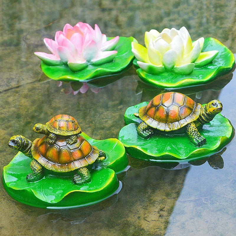 Turtle resin ornaments floating on the water surface