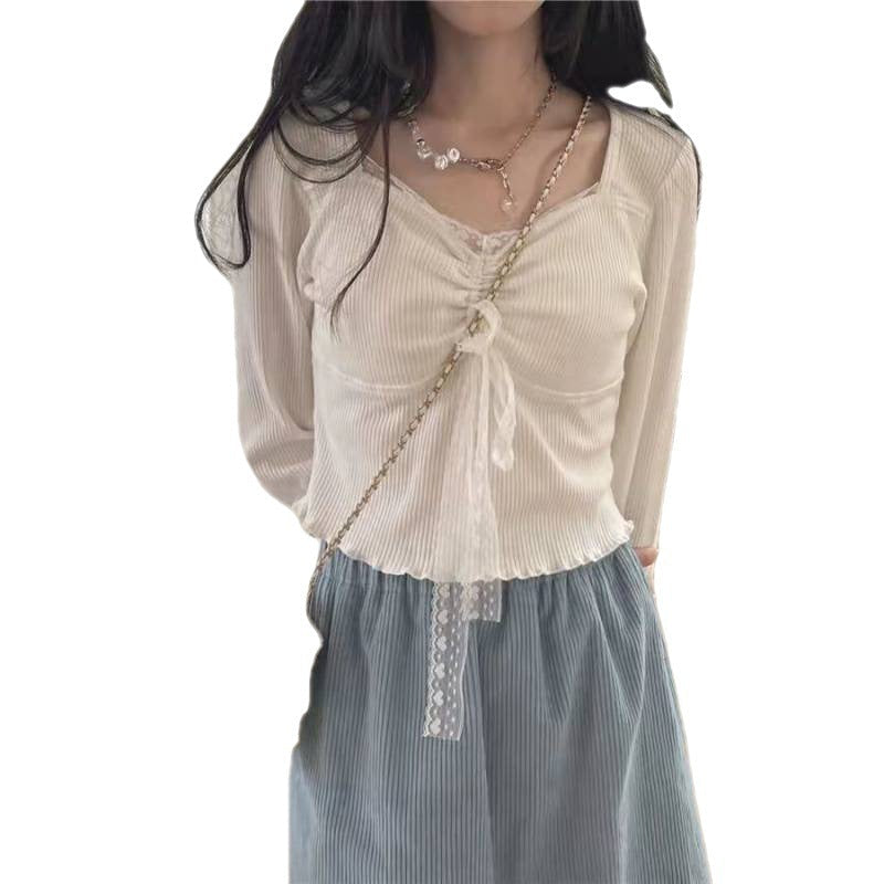 A Woman Wearing A Sweater With A Base Top